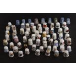 A large collection of 20th Century ceramic thimbles, including Royal Worcester (27), Wedgewood (