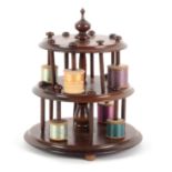 A mahogany reel stand, of three circular tiers raised on three bun feet, the baluster turned stem