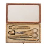 A good French six piece silver gilt sewing set in the style of Palais Royal, circa 1840, contained