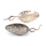 Two silver leaf bowl caddy spoons, one with leaf engraved bowl and pierced border to a wire work