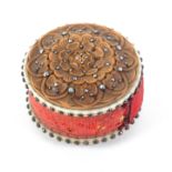 A carved walnut, bone and cloute work drum form pin cushion, with floral and leaf carved decoration,