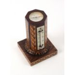 A Tunbridge ware combination desk thermometer/compass by Edmund Nye, the square rosewood base