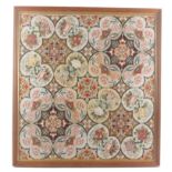 An elaborate Victorian wool work tapestry panel, worked with geometric panels within panels of