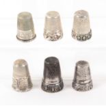 Six white metal continental thimbles, with decorative friezes, one stamped 'BLd 925'. (6) From the