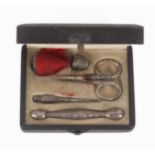 An American sterling silver sewing set, circa 1910, the leatherette rectangular case internally