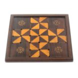 A scarce Tunbridge ware rosewood playing board for the game of 'Fox And The Geese', the geometric