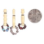 Three 19th Century turned bone miniature lace bobbins, presumably for a doll, largest 3.2cms and