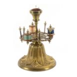 A gilt brass reel stand, the bell form base cast with palm leaves and supporting a pierced