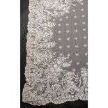 An attractive late 19th Century/early 20th Century Brussels bobbin applique lace shawl, with a broad