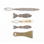 Five ribbon threaders, comprising two white metal graduated examples in the form of fish, both