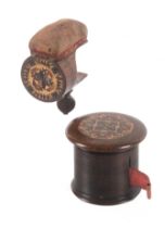 A Tunbridge ware rosewood counter tape measure and a sewing clamp, the large tape measure of rib