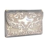 A silver mounted Art Nouveau style leather sewing wallet, the green leather interior with needle