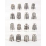 Sixteen English silver thimbles, mostly early 20th Century. (16)