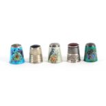 Five 20th Century English silver thimbles, comprising four by James Swann and Son, three with enamel