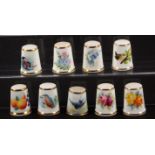 Royal Worcester black mark hand painted and signed porcelain thimbles, comprising an example painted