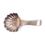 A scallop shell bowl, silver caddy spoon, the handle initialled 'SJ' London, 1788, by Hester