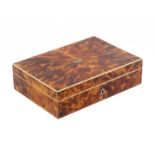 A tortoiseshell sewing box, circa 1810, of rectangular form veneered in pewter edged segments with a