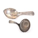 Two silver caddy spoons, comprising a plain leaf bowl example to a divided handle initialled '