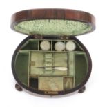 A rosewood and mother of pearl inlaid sewing box circa 1840, of near oval form raised on four ring