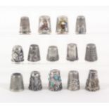 Fourteen thimbles, including twelve continental and other silver examples. (14)