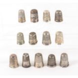 Thirteen silver thimbles, all with some damage, seven marked. (13) From the collection of Roy