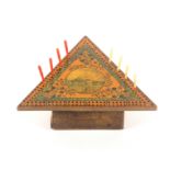 An unusual early Tunbridge ware painted white wood cribbage board of triangular form, centred by a