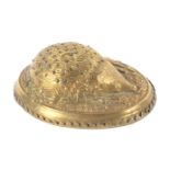 A gilt brass Avery pin cushion 'Hedgehog', slight denting to underside, 9cms.   Registered 1872.