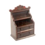 An unusual painted and stained pine 19th Century reel stand in the form of a miniature dresser,