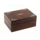 A rosewood sewing box of rectangular form, circa 1880, the front with brass lines and replacement