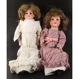 Two porcelain headed dolls, circa 1920, comprising a Heubach example with rolling eyes and closing