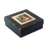A deep green cardboard sewing box for a child, circa 1880, of square form, the lid with colour print