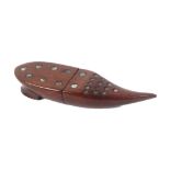A scarce mahogany needle case in the form of a pointed shoe, the upper surface with inset steel