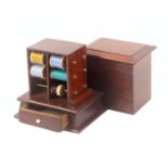 An unusual mahogany reel stand, circa 1850, the canted rectangular base fitted with a drawer below a