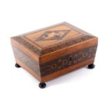 A rosewood Tunbridge ware sewing box of sarcophagol form, the sides with a broad band of stick ware,