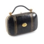 A leather and gilt brass mounted sewing companion in the form of a bag, circa 1890, of rounded