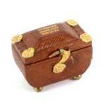 A fine Regency brown leather needle packet box of sarcophagal form, in cross hatched leather