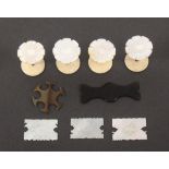 Four reel holders and five thread winders, comprising a set of four mother of pearl top reel holders