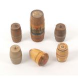 Six white wood sewing accessories, comprising a thimble case with painted decoration, three cotton