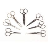 Seven pairs of steel scissors, two pairs with file cut decoration, largest, 10.5cms. (7)