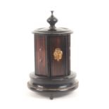 An unusual French musical box sewing companion, circa 1880, the turned and ebonised gilt mounted