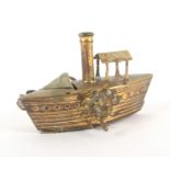 A gilt brass novelty tape measure in the form of a single funnel paddle steamer, the complete