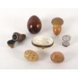 Seven thimble cases and four silver thimbles, comprising a pearl egg form example, 5.5cms, a