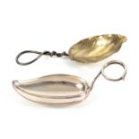 Two American leaf bowl caddy spoons, with curled wire handles, one stamped 'Sterling L', the