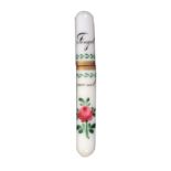 A rare white glass cylinder needle case, attractively painted with rose, leaves and other motifs and