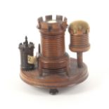 A rosewood turret form sewing companion, circa 1850, the circular base raised on three bun feet,