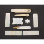 A group of mother of pearl items, comprising a Chinese export cut corner rectangular tooth pick