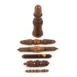 Six various needle cases, comprising a turned and carved standing wooden example inscribed '