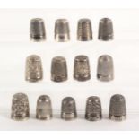 Thirteen 'Dorcas' and Pat. thimbles, together with Dorcas stand, comprising nine marked 'Dorcas',
