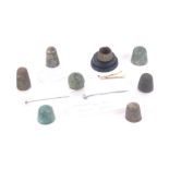 A collection of excavated thimbles and pins, comprising eight medieval and later thimbles mostly