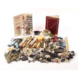 A mixed lot - sewing, comprising a selection of needle packets, bobbins, three ceramic pin cushions,